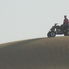 A local on their quad 4x4 Desert Wonder Safari - Sandboarding, BBQ Dinner and Bellydancer
