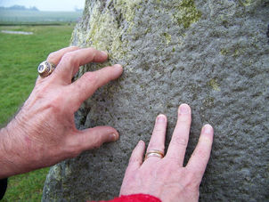 Touching the stones at Stonehenge Stonehenge Private Viewing, Bath and Lacock
